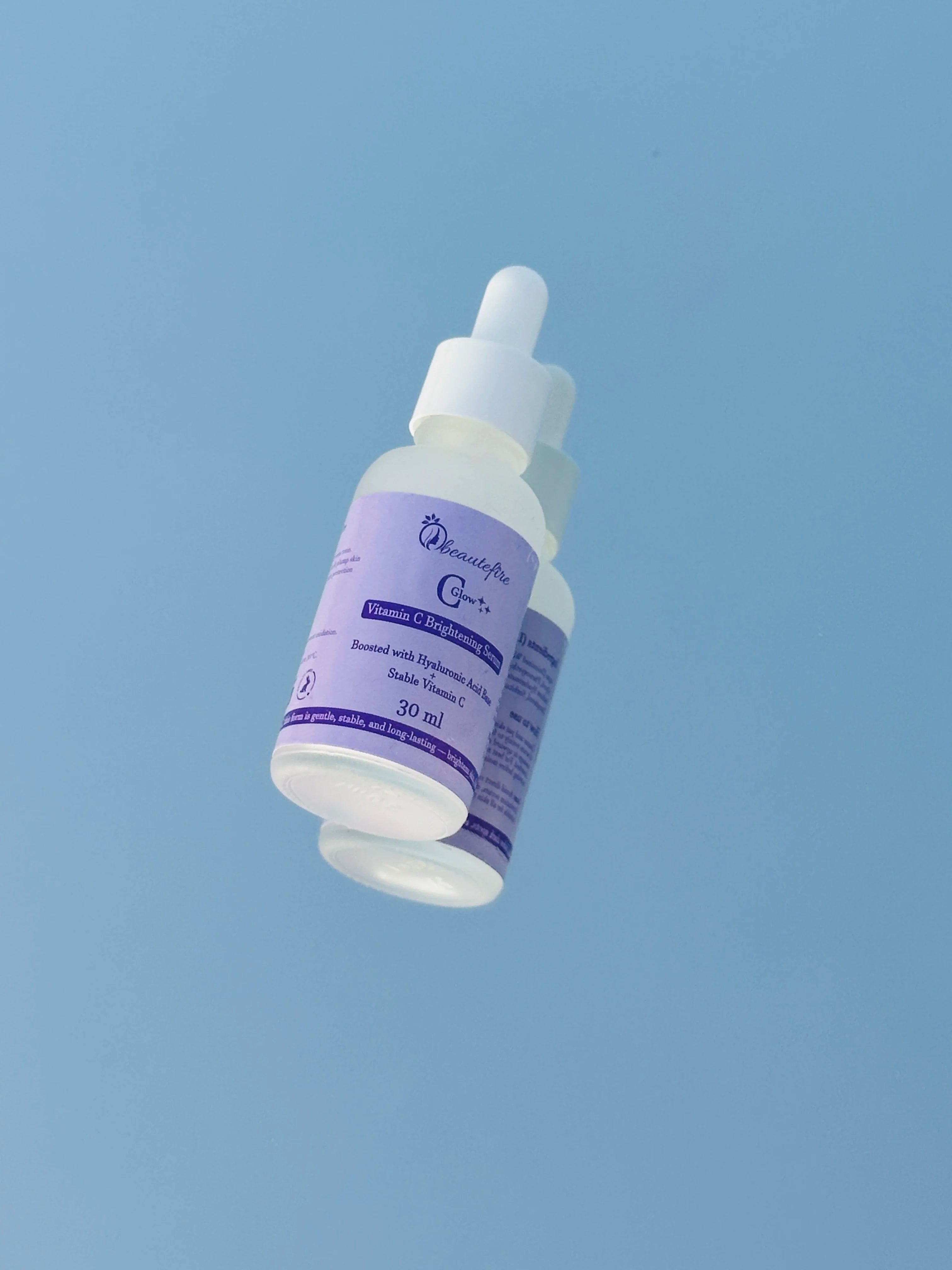 Beautefire C Glow Serum on mirror ā luxury Vitamin C skincare showcasing radiance and premium design.