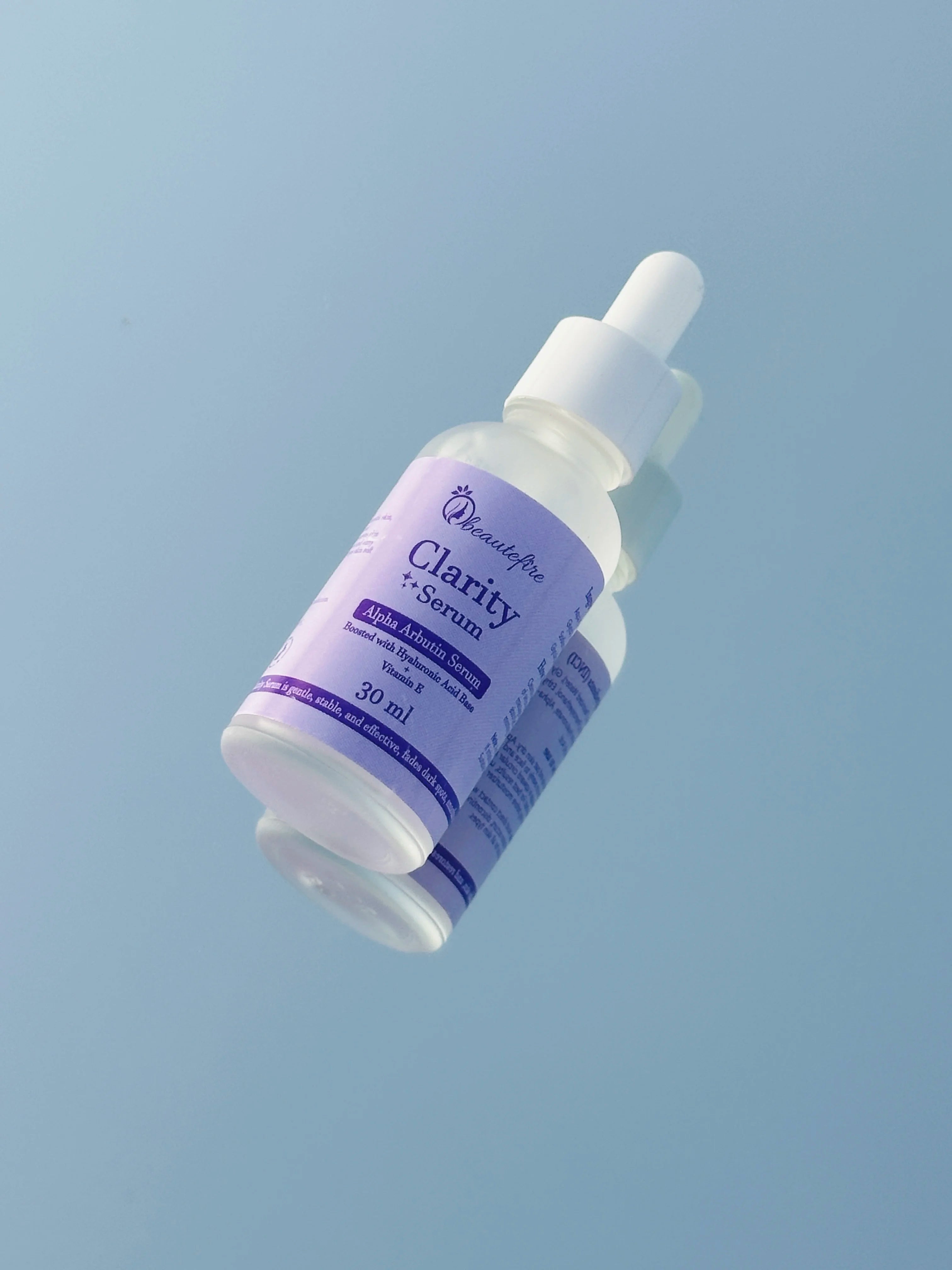 Beautefire Clarity Alpha Arbutin Serum ā Brightening serum displayed with natural ingredients symbolizing purity and glow