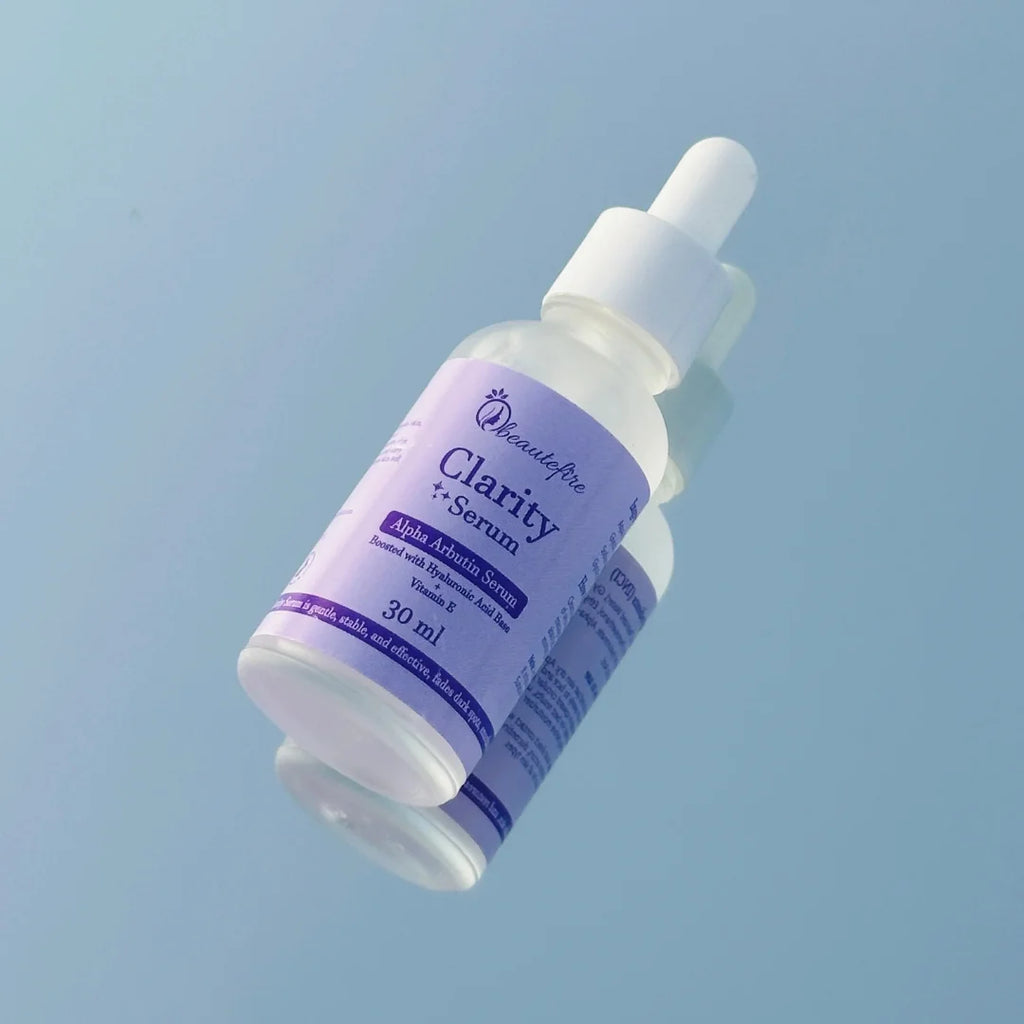 Beautefire Clarity Alpha Arbutin Serum – Brightening serum displayed with natural ingredients symbolizing purity and glow