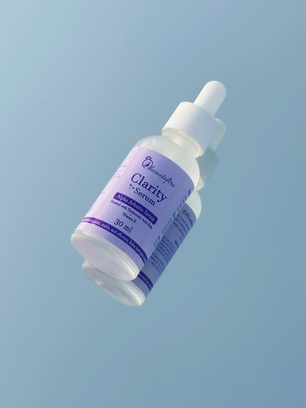 Beautefire Clarity Alpha Arbutin Serum – Brightening serum displayed with natural ingredients symbolizing purity and glow