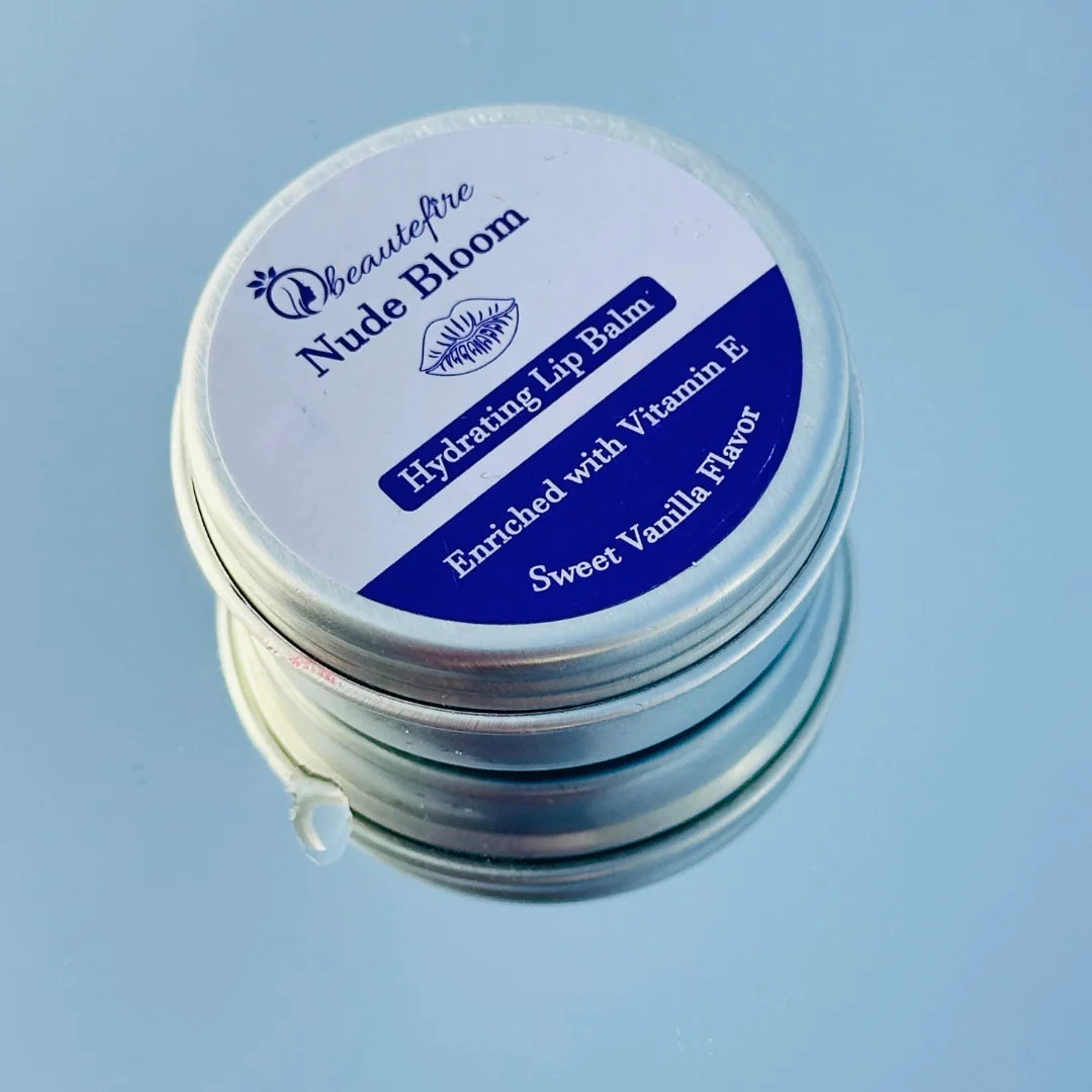 Beautefire Nude Bloom Lip Balm on sky with mirror — elegant nude-tinted balm reflecting a soft, natural glow with deep nourishment.