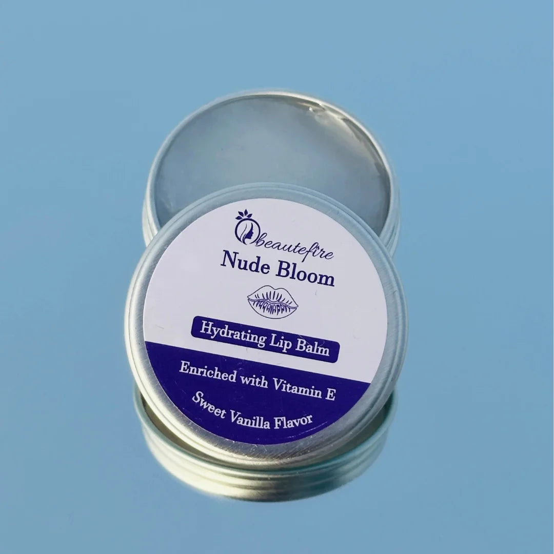 Beautefire Nude Bloom Lip Balm on sky with mirror — elegant nude-tinted balm reflecting a soft, natural glow with deep nourishment.