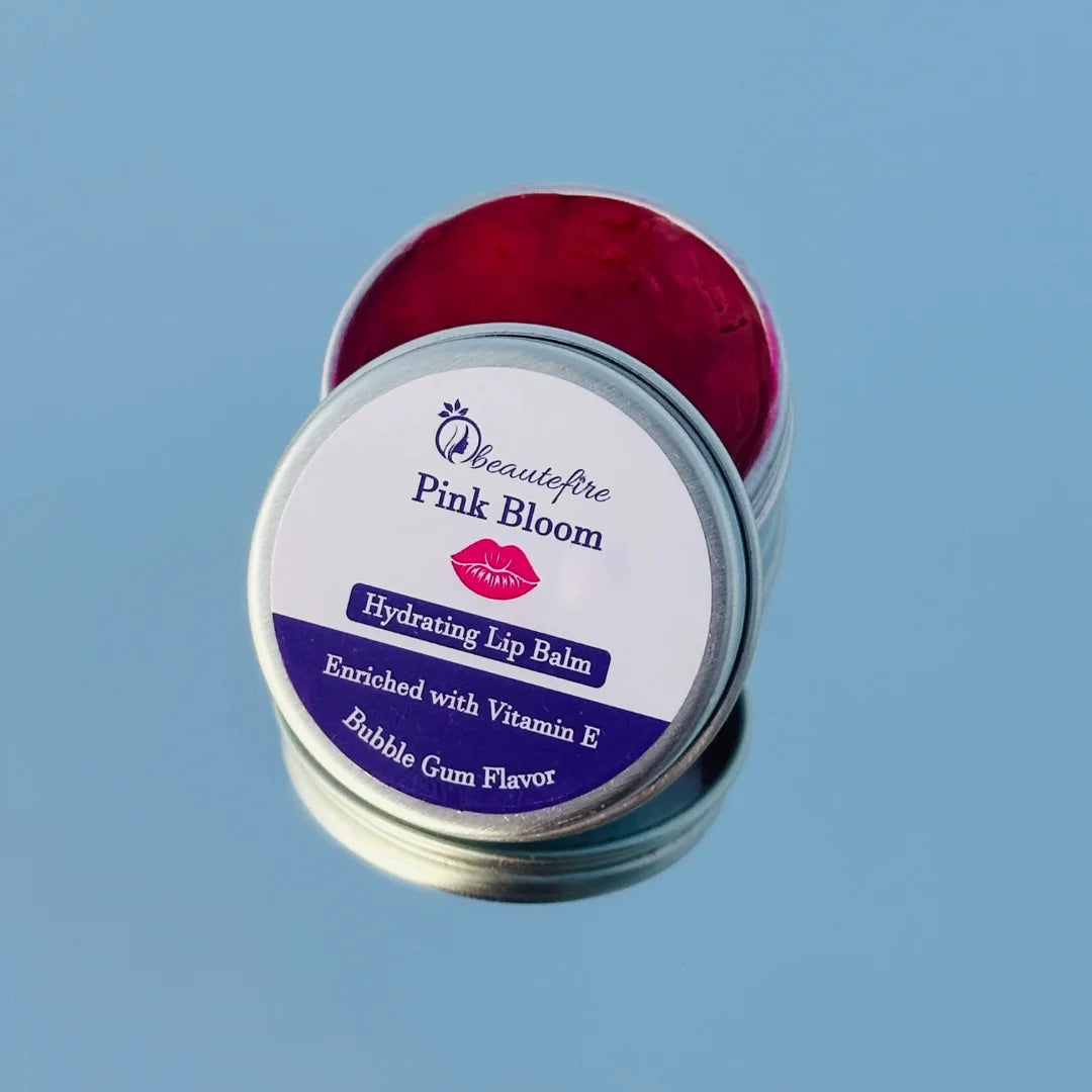Beautefire Pink Bloom Lip Balm on mirror and sky — premium tinted balm reflecting soft pink glow and hydration.