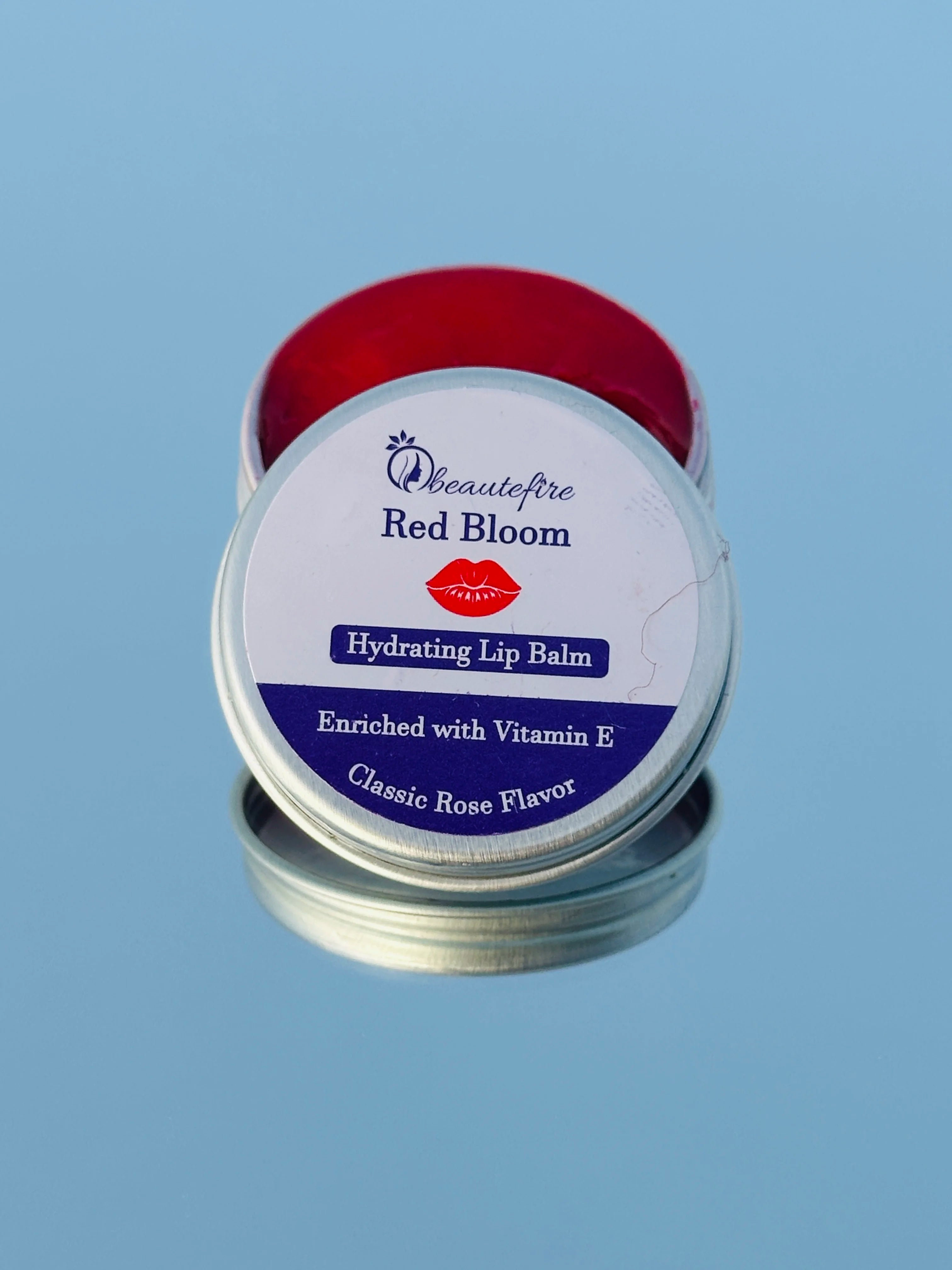 Beautefire Red Bloom Lip Balm on mirror — luxury hydrating balm that restores damaged lips naturally.